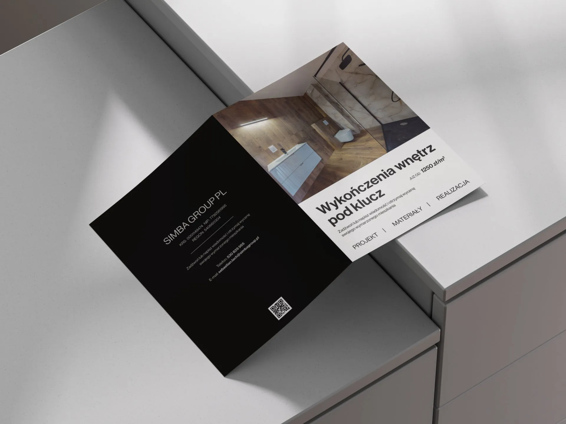 Folder reklamowy dla firmy wykańczającej wnętrza - wizualizacja pierwszej wersji tył folderu